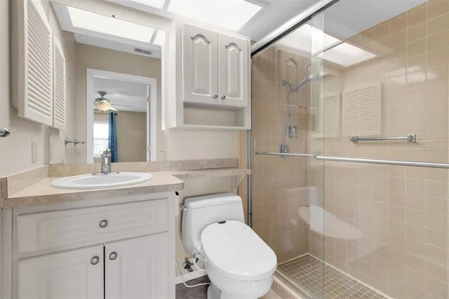 a bathroom with a glass shower door