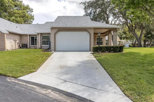 a view of an house with a yard