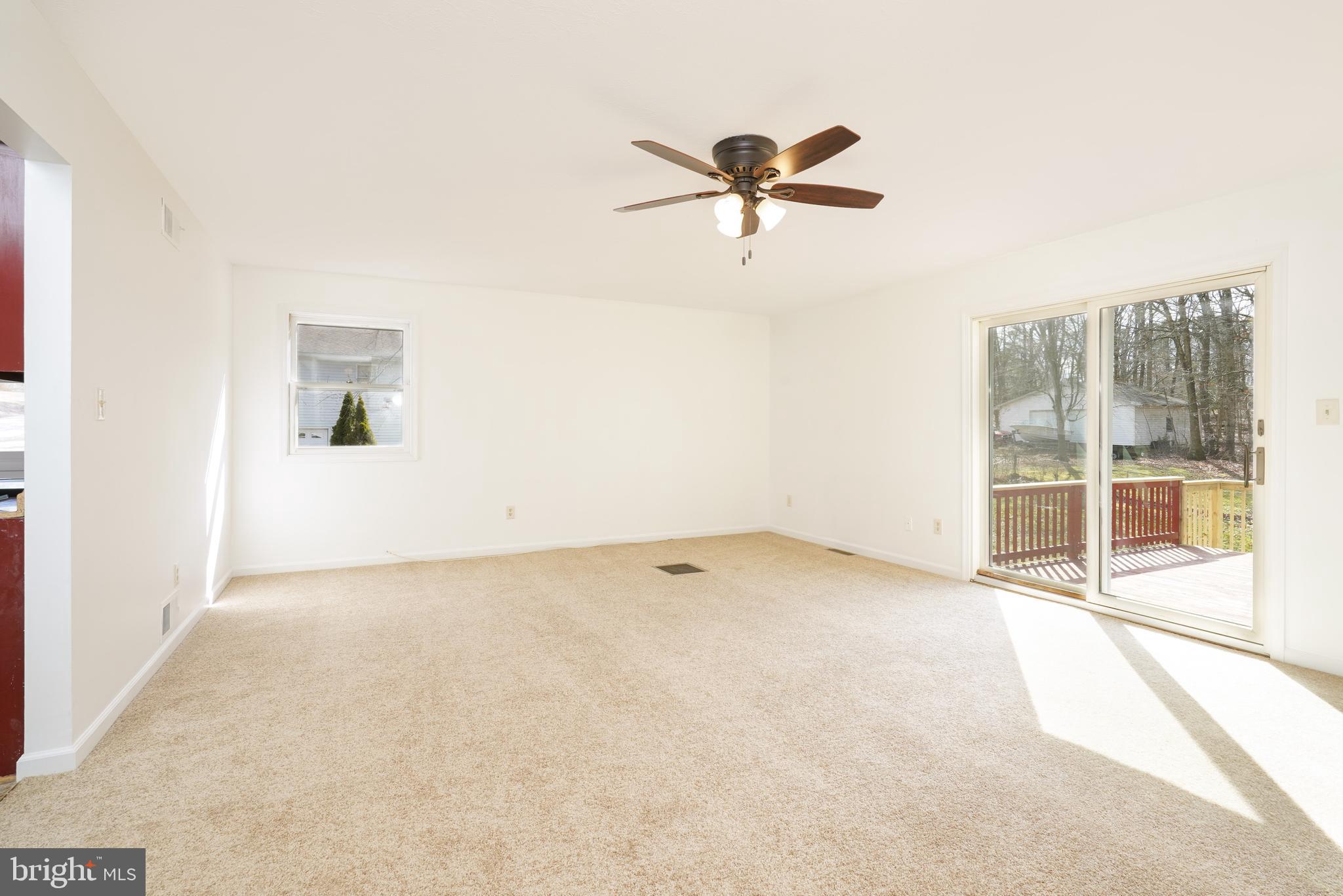 832 Nottingham Road Elkton, MD 21921 - Photo 7 of 25 Living room with sliders to the deck