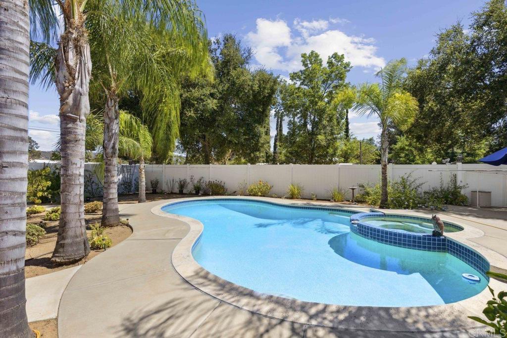 a view of a swimming pool with a patio