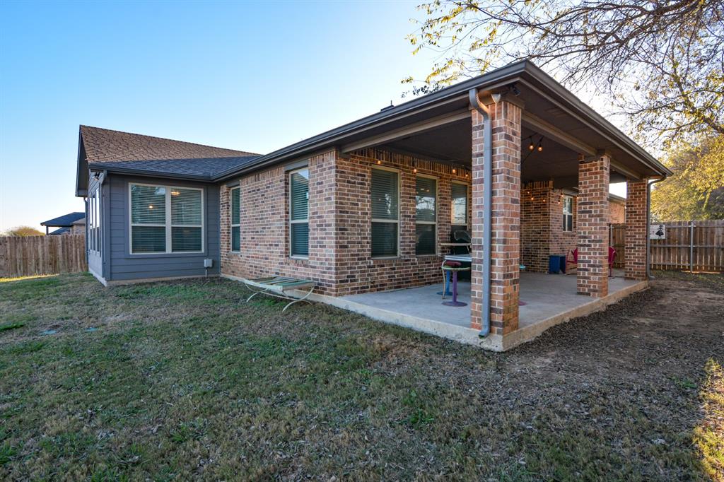 601 Mathew Street Grandview, TX 76050 - Photo 34 of 40 a front view of a house with a garden