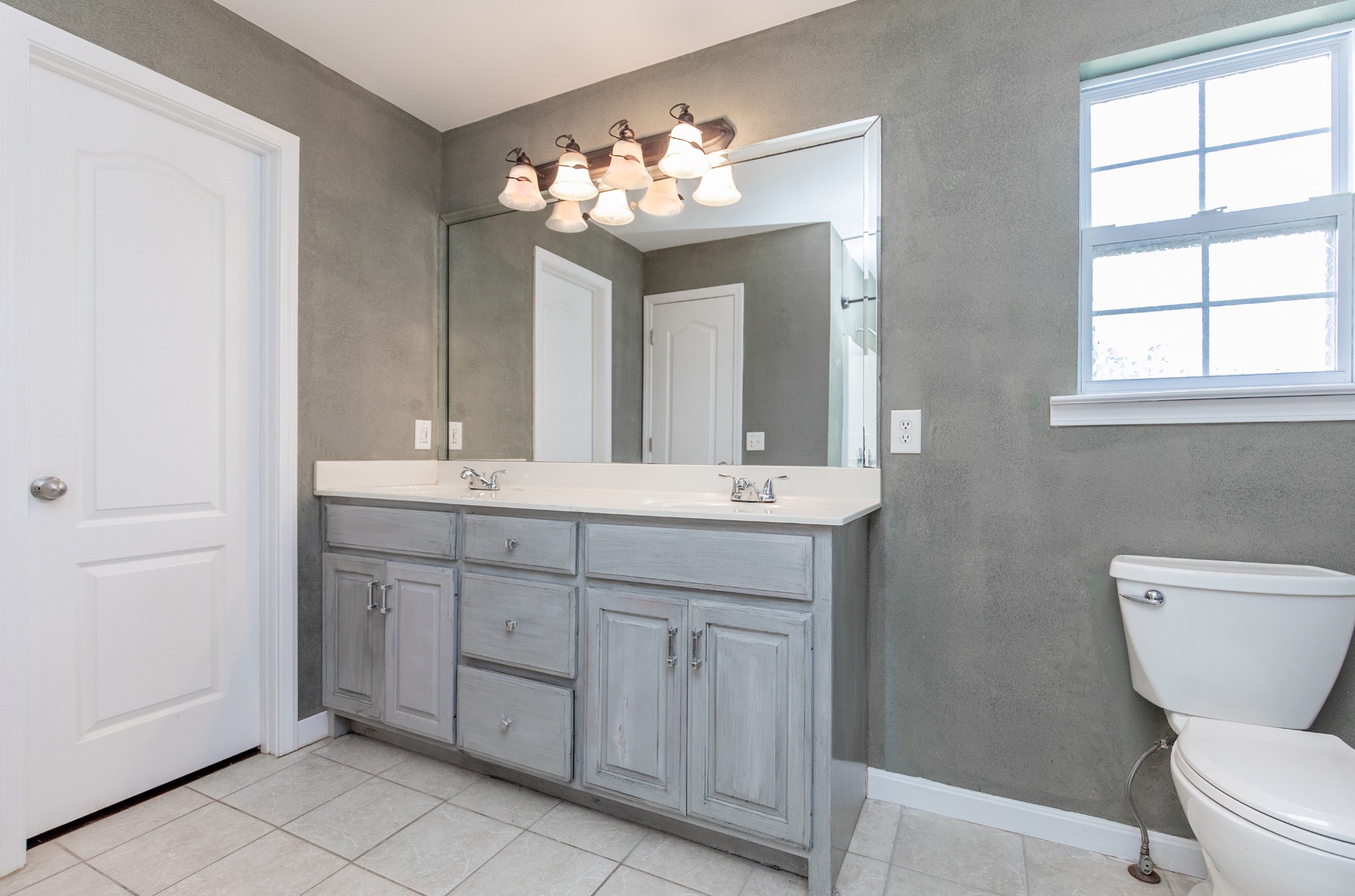 443 Clearview Road Cottontown, TN 37048 - Photo 11 of 21 a bathroom with a double vanity sink and a toilet