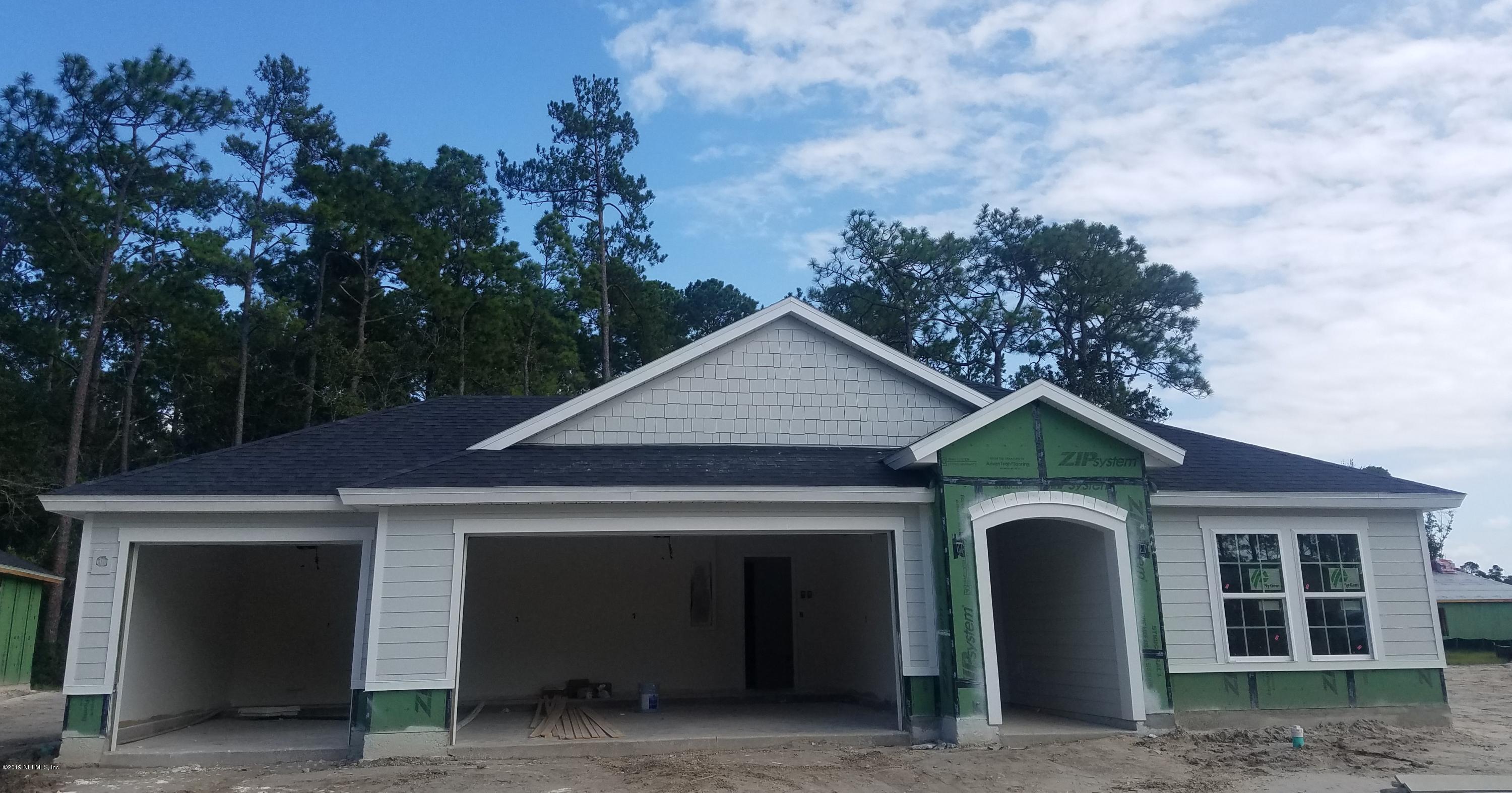 274 Flach Drive St. Johns, FL 32259 - Photo 2 of 2 a front view of a house with garden