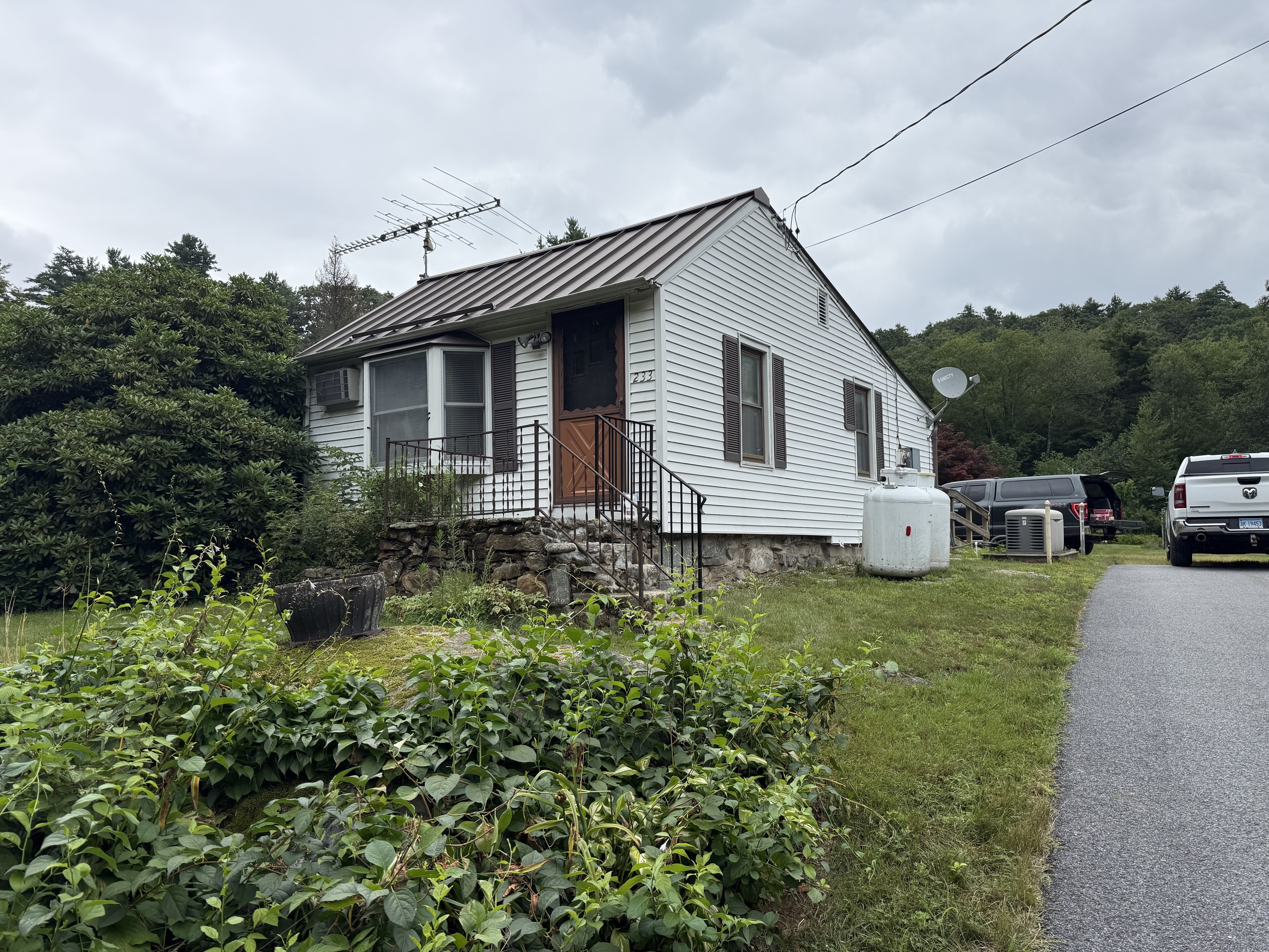 233 Grantville Road Winchester, CT 06098 - Photo 1 of 1 a front view of a house with a yard