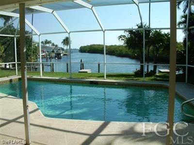 15551 Shell Point Boulevard Fort Myers, FL 33908 - Photo 1 of 9 a view of a swimming pool with a patio