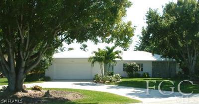 15551 Shell Point Boulevard Fort Myers, FL 33908 - Photo 2 of 9 a view of a backyard with a patio