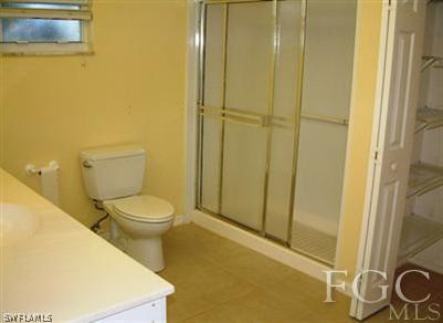 15551 Shell Point Boulevard Fort Myers, FL 33908 - Photo 8 of 9 a white toilet sitting next to a bathroom sink