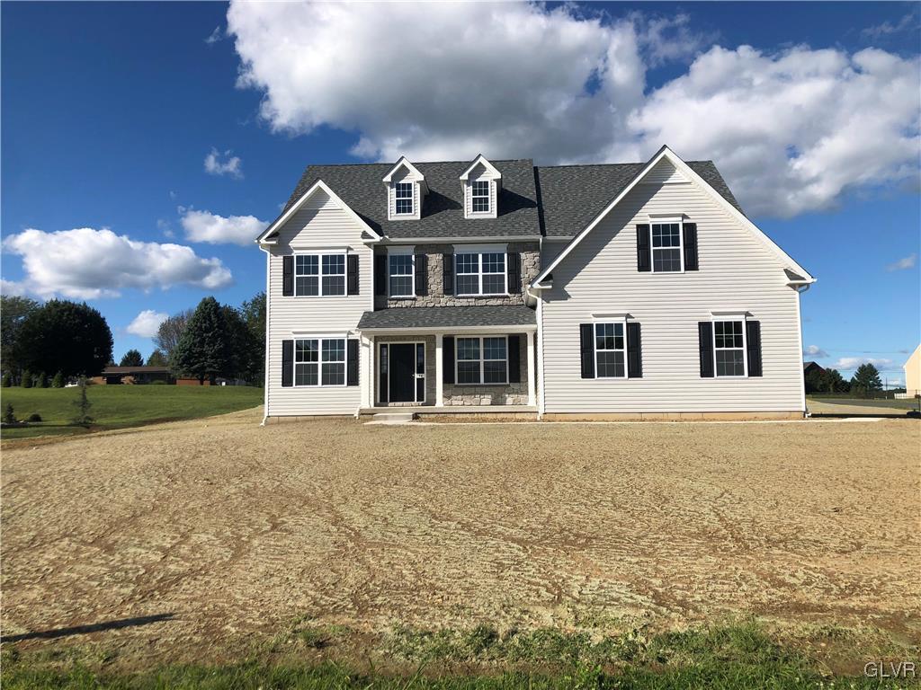 344 Aubrey Road, Unit 37 Nazareth, PA 18064 - Photo 1 of 1 a front view of a house with a yard