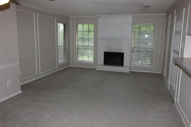 a view of a livingroom with a fireplace