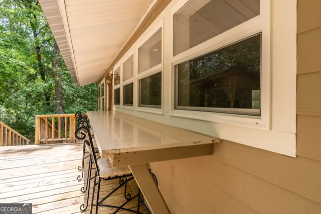 a view of a balcony with wooden floor