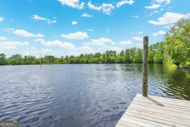 a view of a lake with green space