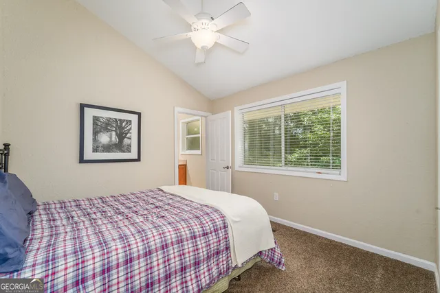 a room with a sink and a mirror