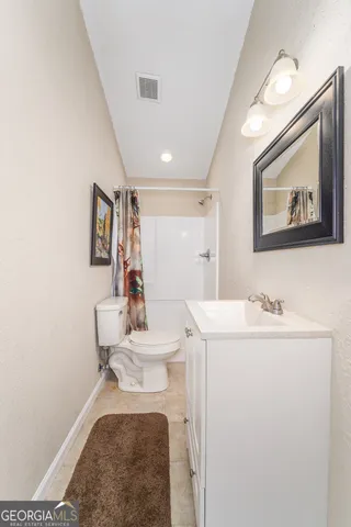 a bedroom with bed and a window