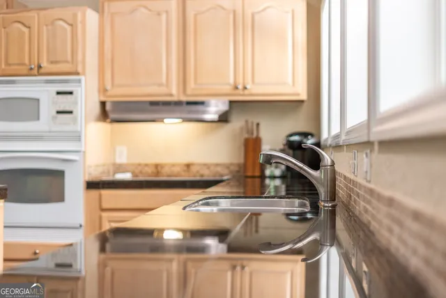 a view of a balcony with chairs