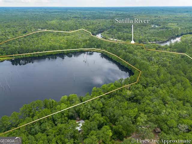 a view of a balcony with a yard