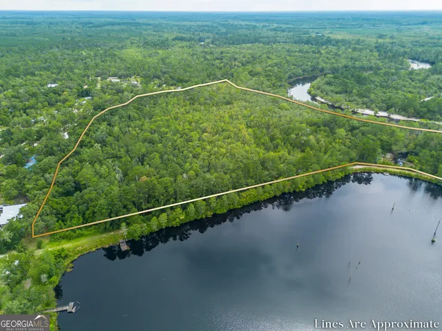 a view of a swimming pool and a yard