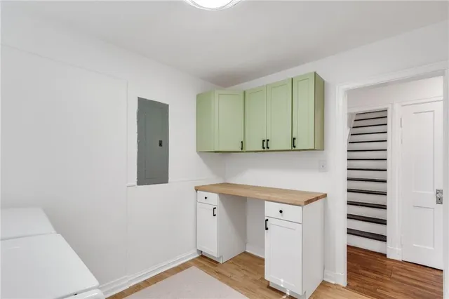 a kitchen with a sink and cabinets