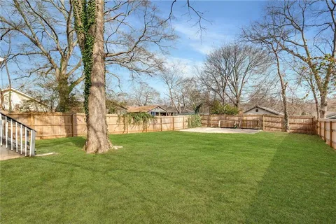 a view of yard with tree and green space