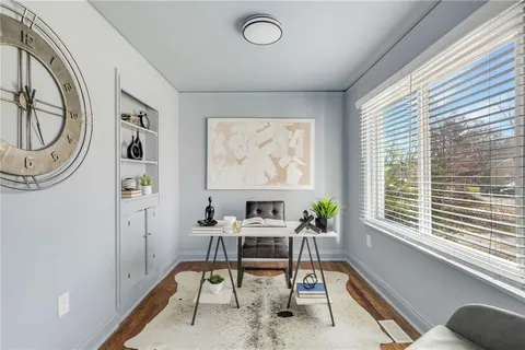 a workspace with furniture and a window