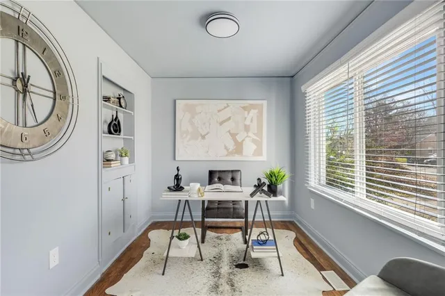 a workspace with furniture and a window