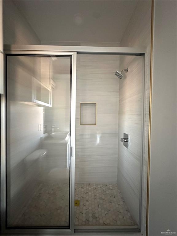 1038 Yellow Hammer Street Rio Grande City, TX 78582 - Photo 17 of 20 a bathroom with a glass shower door