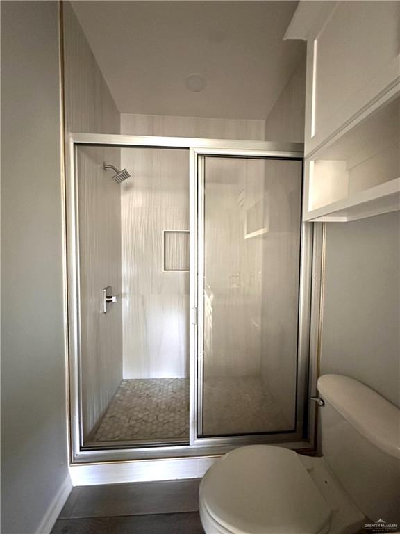 1038 Yellow Hammer Street Rio Grande City, TX 78582 - Photo 9 of 20 a bathroom with a shower and toilet
