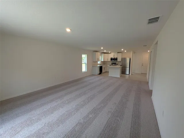 a view of a kitchen with a sink and a stove top oven