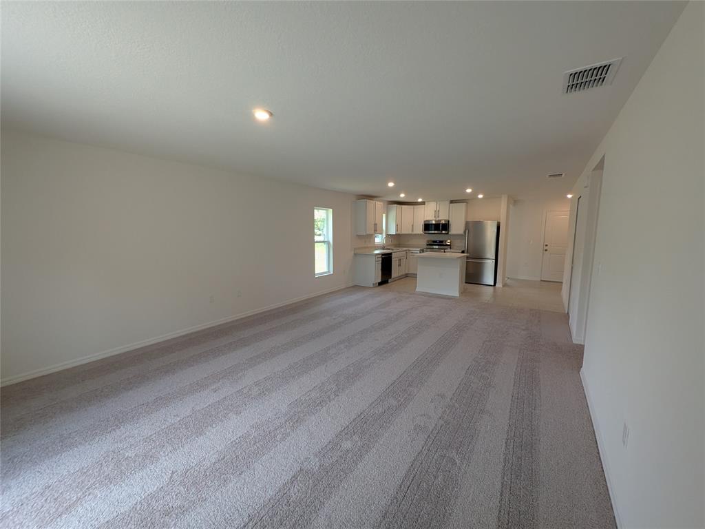 9065 107th Court Vero Beach, FL 32967 - Photo 12 of 40 a view of a kitchen with a sink and a stove top oven