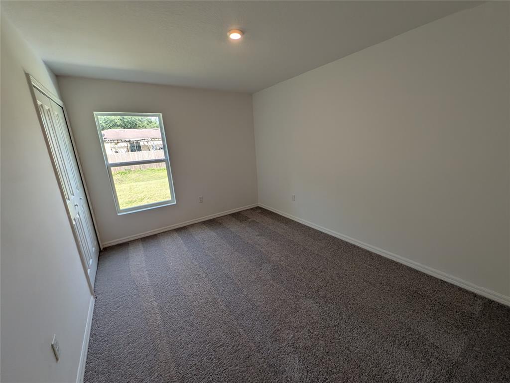 9065 107th Court Vero Beach, FL 32967 - Photo 18 of 40 an empty room with a window