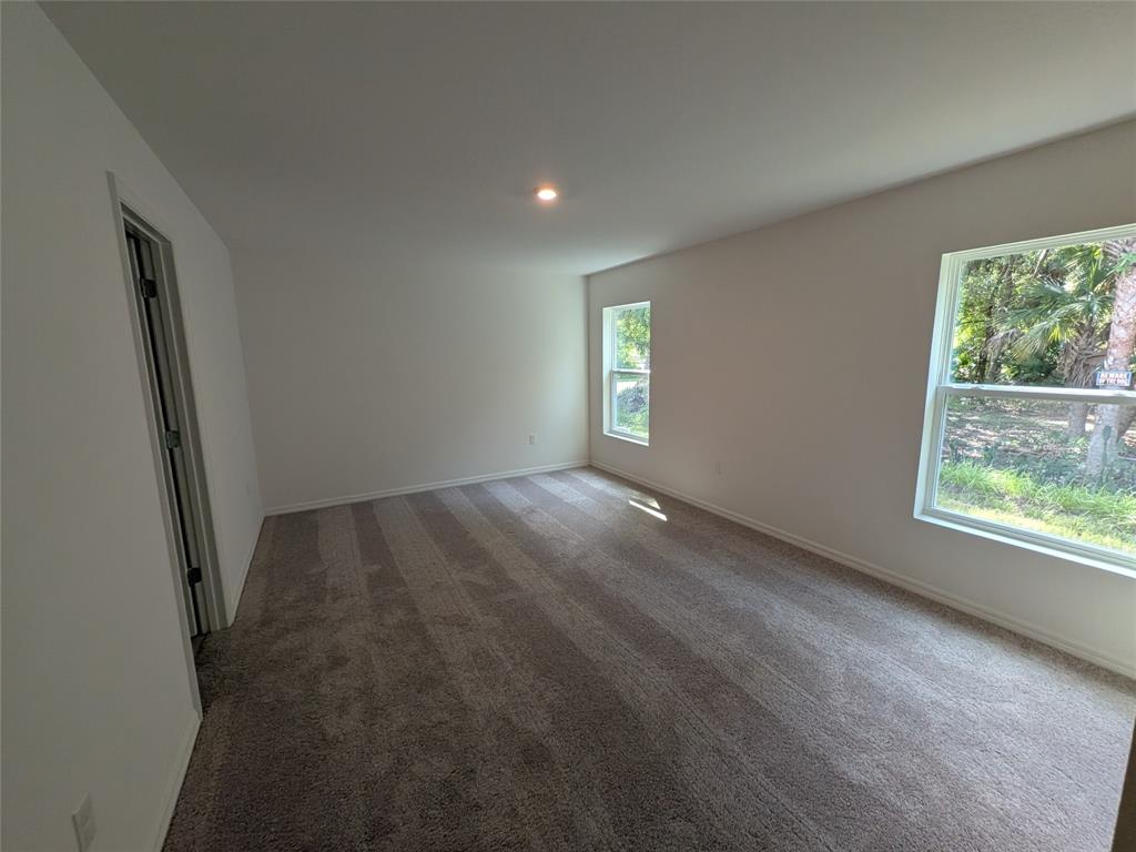 9065 107th Court Vero Beach, FL 32967 - Photo 24 of 40 an empty room with windows