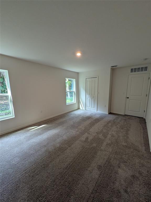 9065 107th Court Vero Beach, FL 32967 - Photo 28 of 40 a view of an empty room with a window