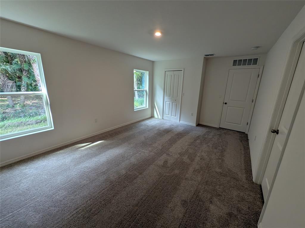 9065 107th Court Vero Beach, FL 32967 - Photo 29 of 40 a view of room with window and hardwood floor