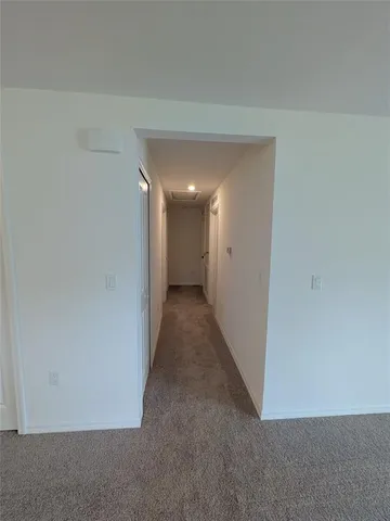 a view of hallway with an empty space