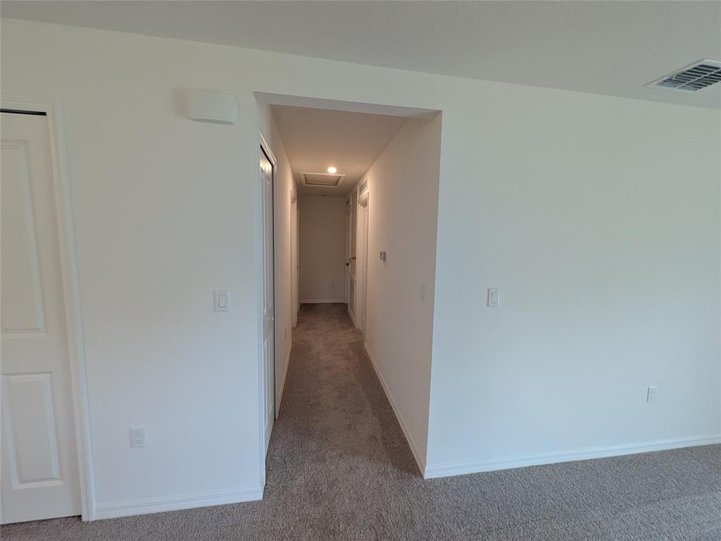 9065 107th Court Vero Beach, FL 32967 - Photo 38 of 40 a view of a hallway with wooden floor
