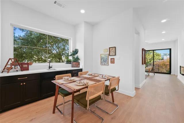 a kitchen with a table and chairs in it