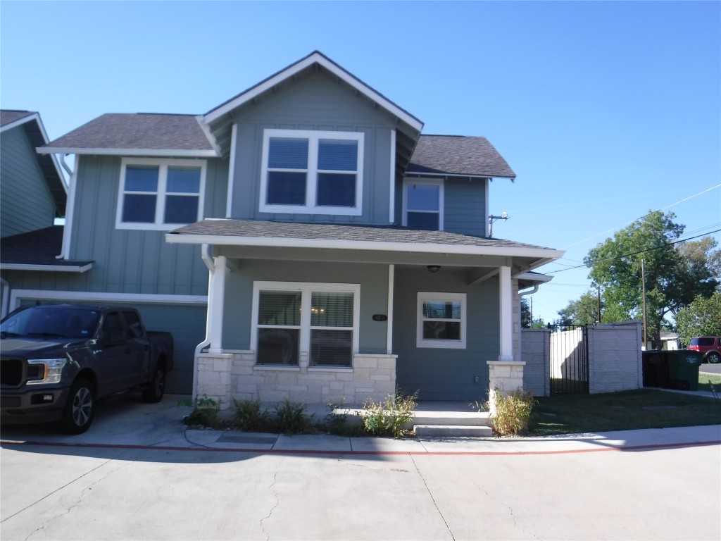 615 Spring Street, Unit 1 Round Rock, TX 78664 - Photo 1 of 1 a front view of a house with a yard