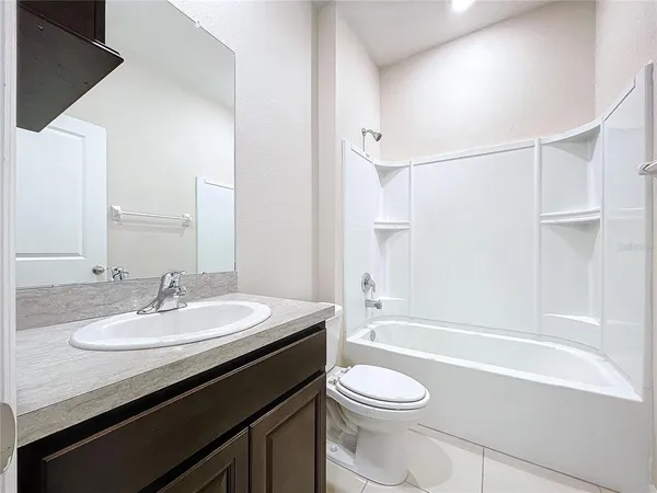 a bathroom with a sink a toilet and a bathtub