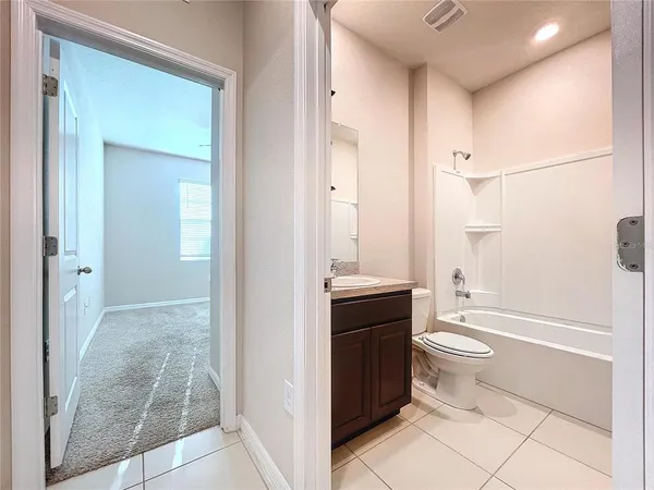 a bathroom with a toilet a sink and bathtub