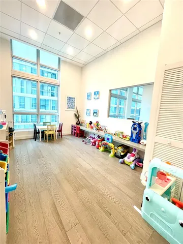 a playing room with toys and a couch