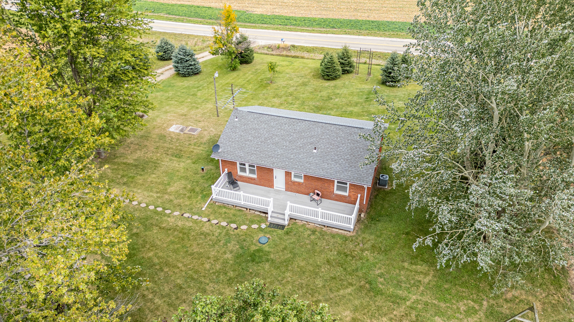 4705 East 7th Road Earlville, IL 60518 - Photo 16 of 21 a view of a back yard of the house with a yard