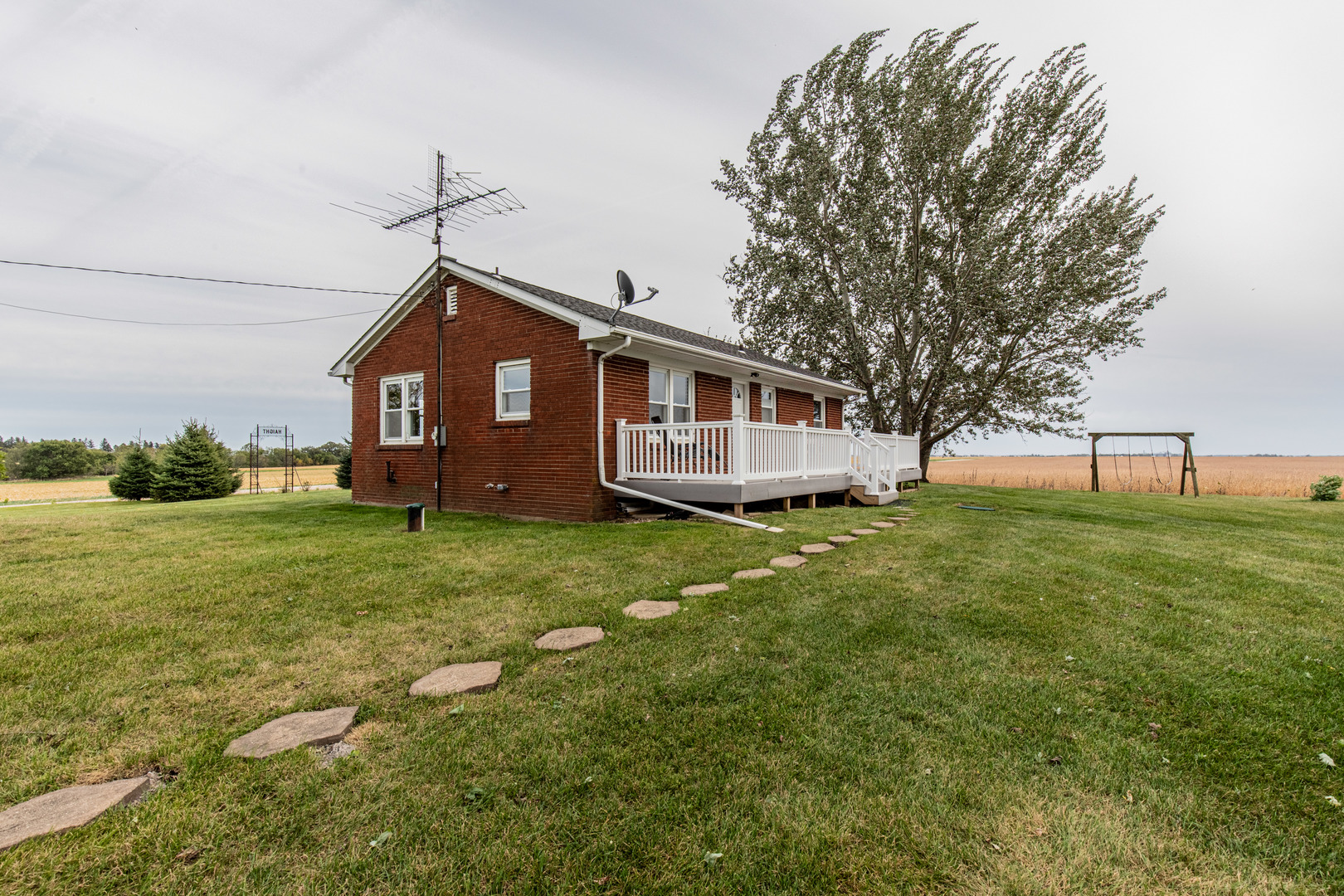 4705 East 7th Road Earlville, IL 60518 - Photo 17 of 21 a front view of a house with garden
