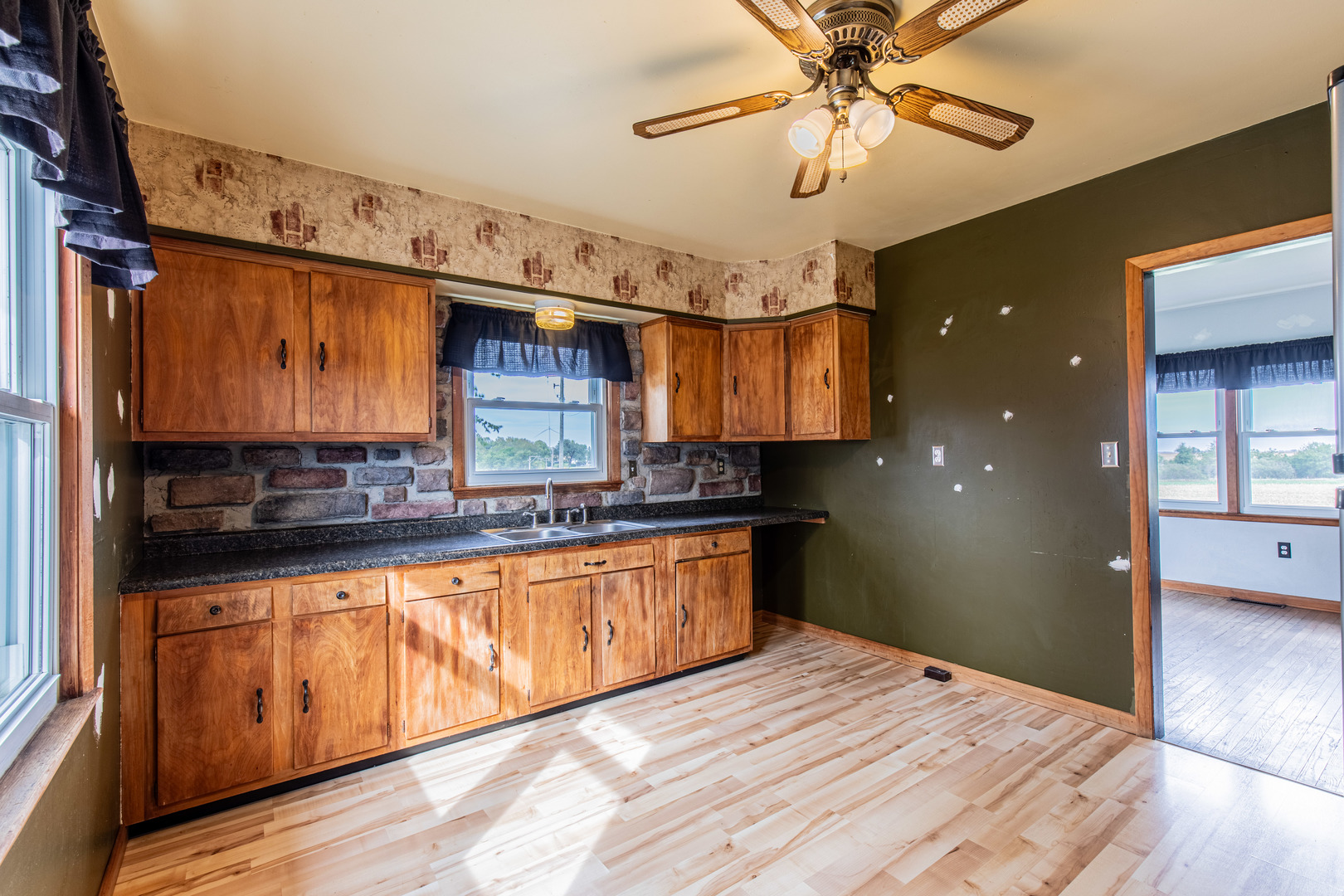 4705 East 7th Road Earlville, IL 60518 - Photo 5 of 21 a kitchen with stainless steel appliances granite countertop a sink and cabinets