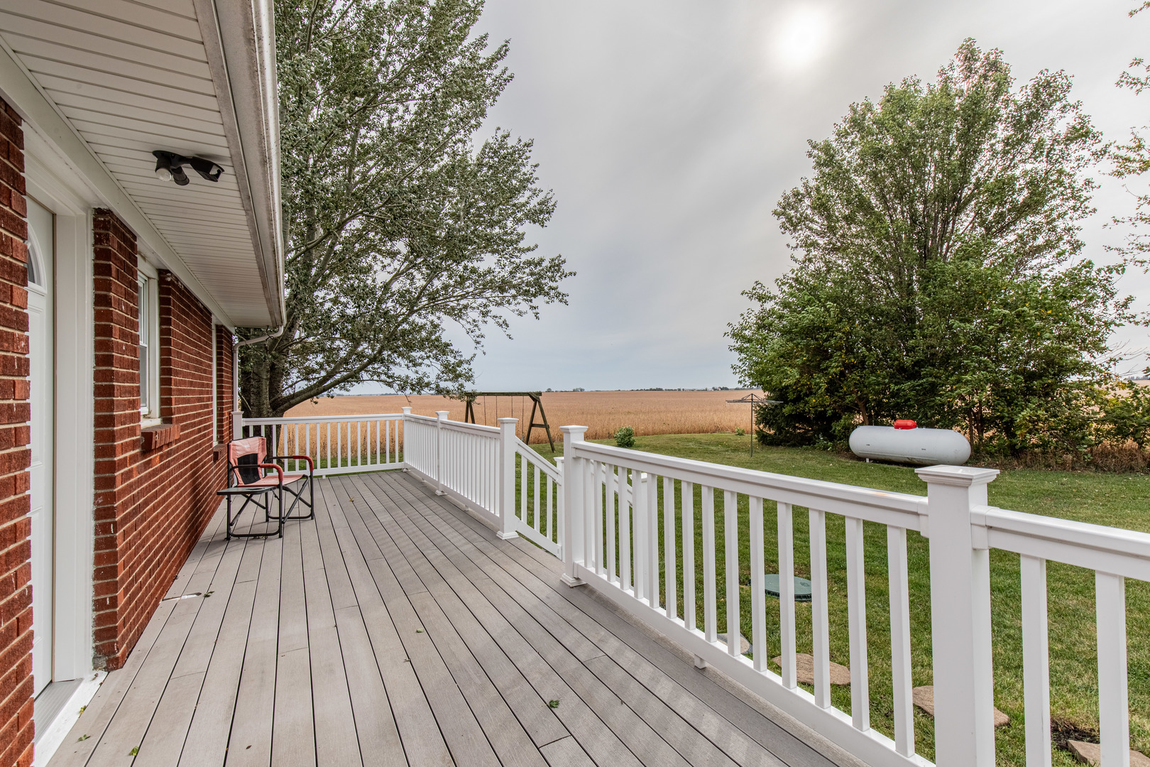 4705 East 7th Road Earlville, IL 60518 - Photo 10 of 21 a view of balcony with wooden floor and fence