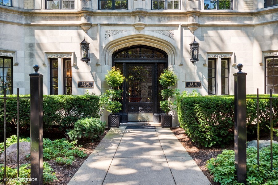 1316 Maple Avenue, Unit E1 Evanston, IL 60201 - Photo 2 of 11 a view of white house with potted plants
