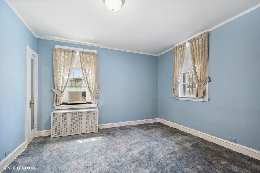 1316 Maple Avenue, Unit E1 Evanston, IL 60201 - Photo 6 of 11 an empty room with windows and closet