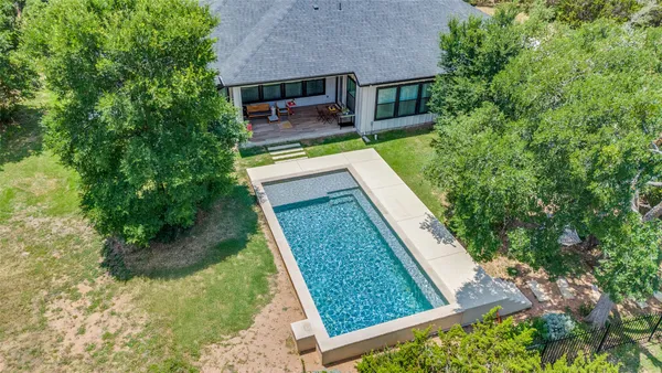 a view of a backyard with sitting area