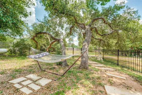 a view of a backyard with water fountain