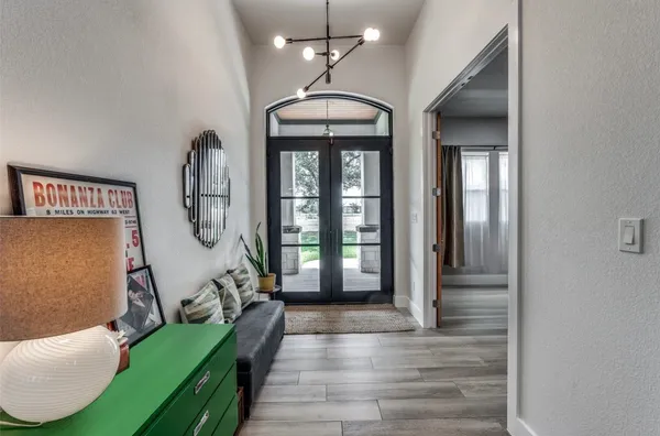 a lobby with furniture and floor to ceiling window