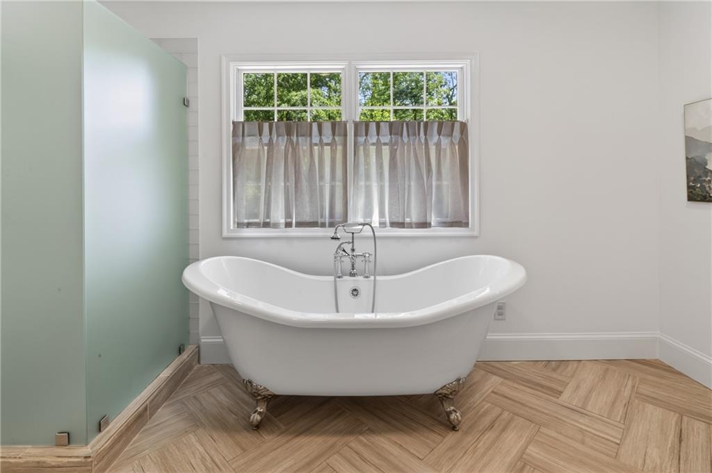 755 Greenview Avenue Northeast Atlanta, GA 30305 - Photo 13 of 28 a white bath tub sitting in a bathroom next to a window