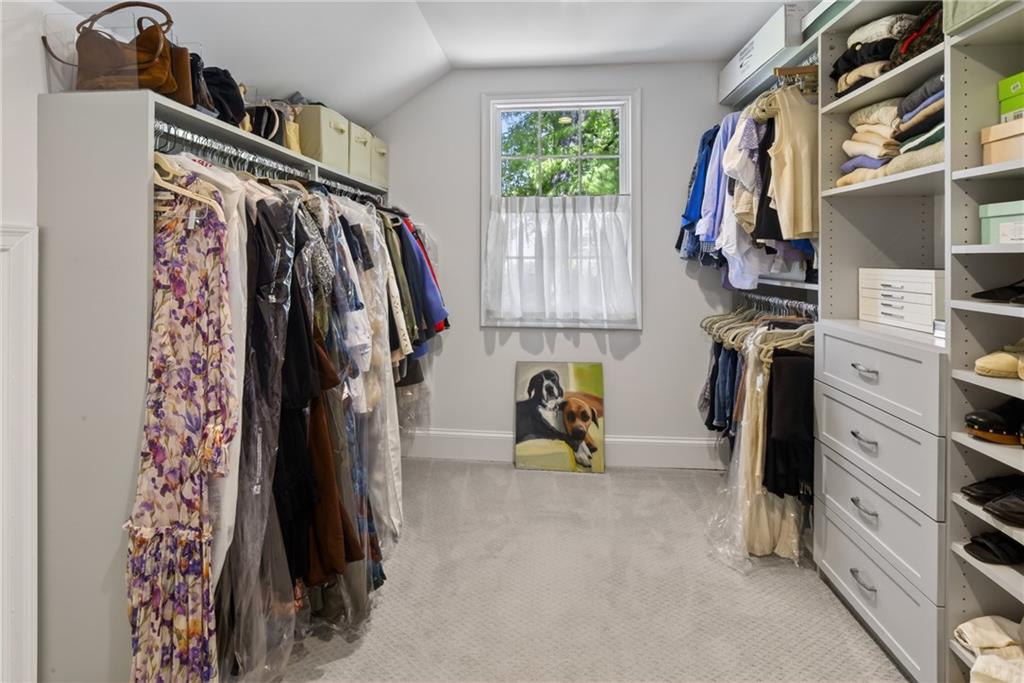 755 Greenview Avenue Northeast Atlanta, GA 30305 - Photo 15 of 28 a view of walk in closet with clothes and shoes